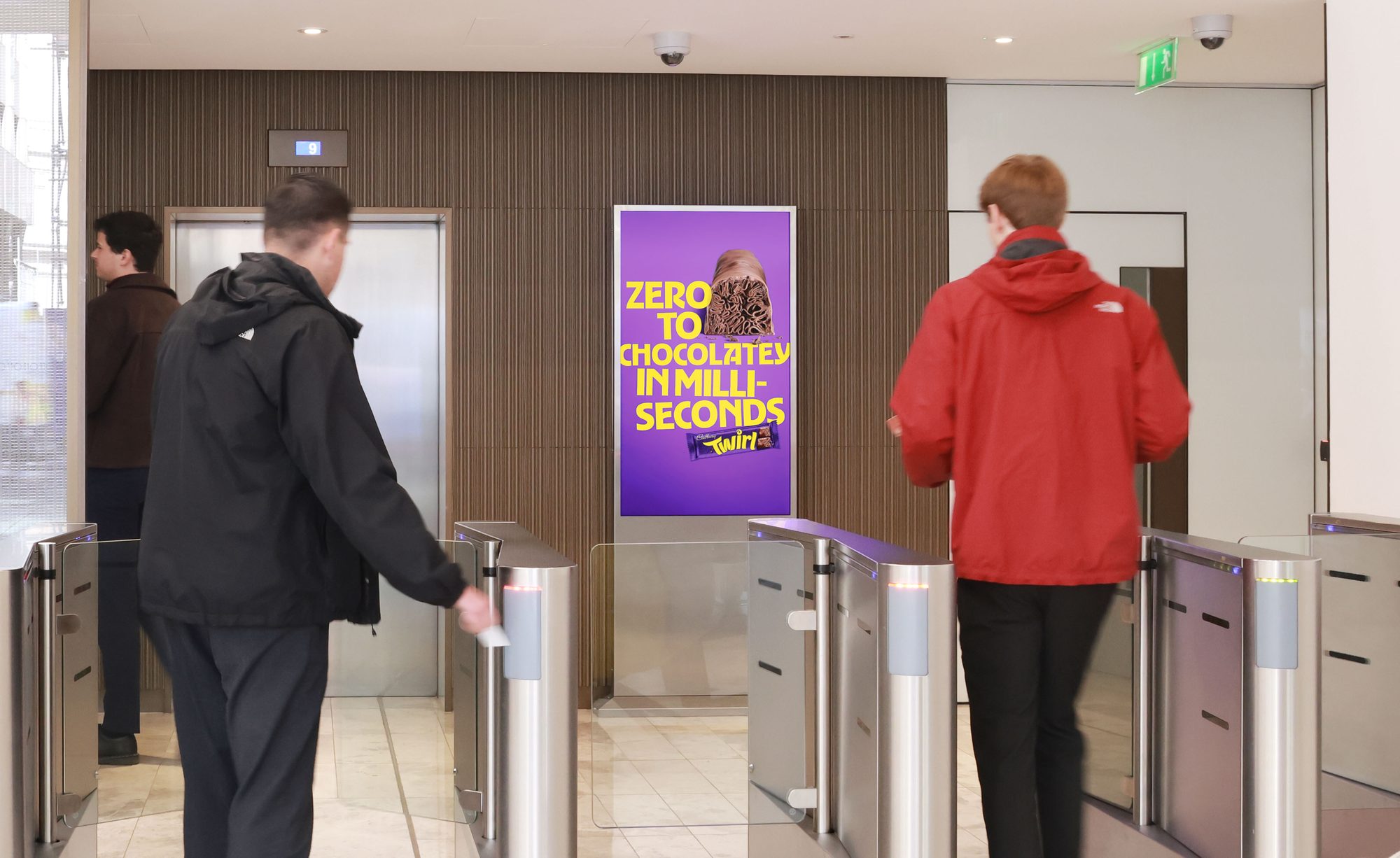 Cadbury Twirl campaign on ECN screen · premium office DOOH