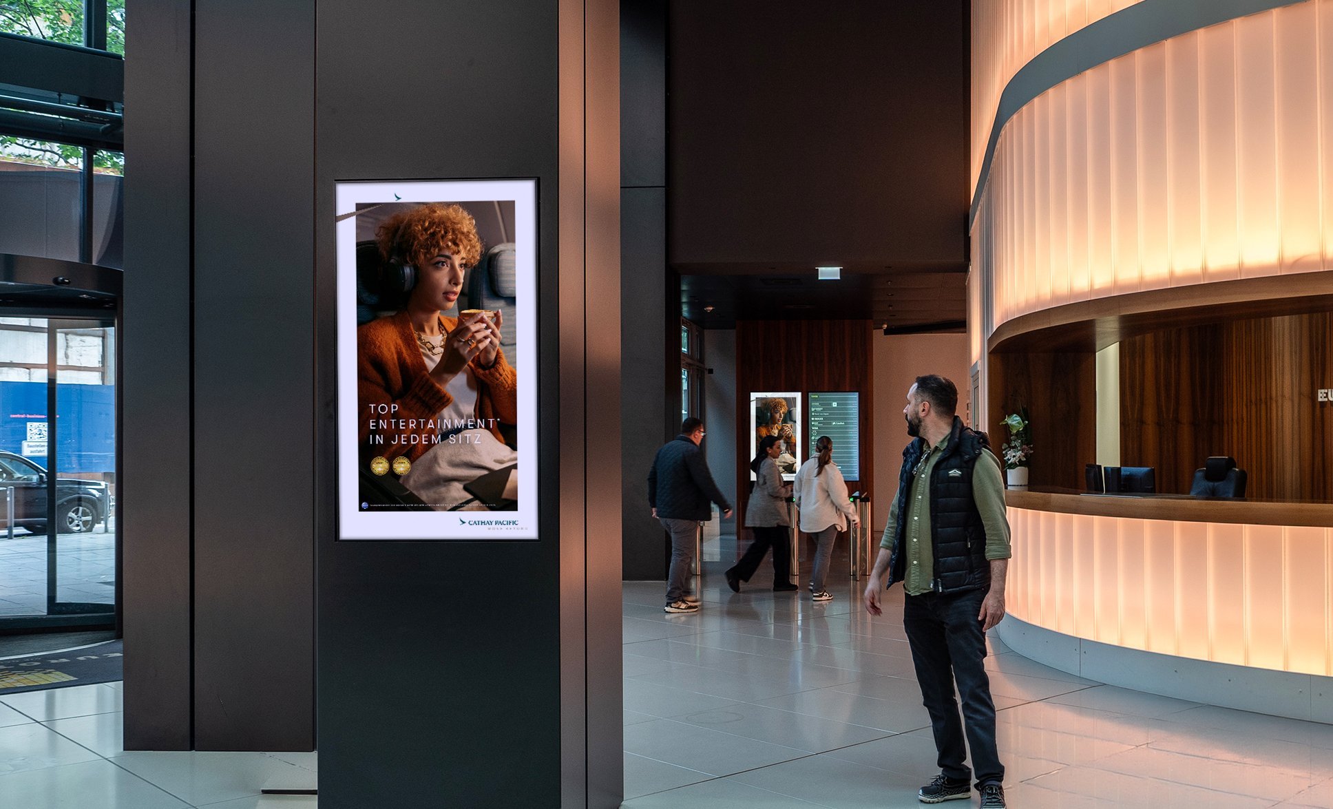 Cathay Pacific Top Entertainment campaign on ECN screen · Eurotheum Frankfurt · premium office DOOH