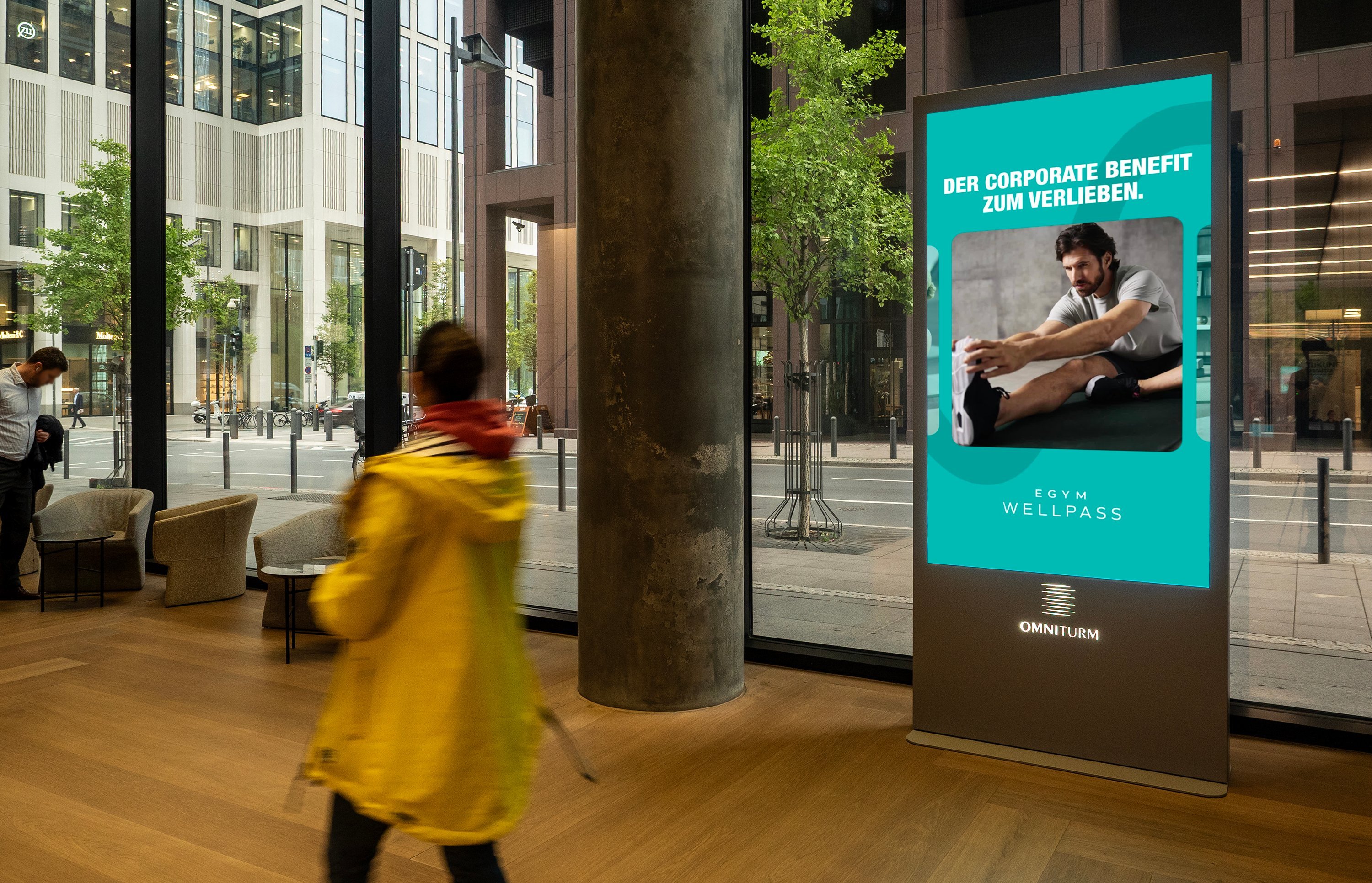 EGYM Wellpass campaign on ECN screen · Omniturm Frankfurt · premium office DOOH