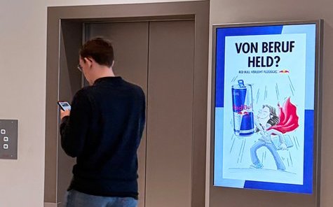Red Bull Von Beruf Held campaign on ECN screen · Arabellastraße München